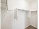 Walk-in closet featuring ample shelving and hanging space at 16030 W Desert Hollow Dr, Surprise, AZ 85387