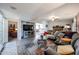 Living room with gray sectional sofa, fireplace, and wood-look floors at 17227 E Rand Dr # A, Fountain Hills, AZ 85268