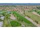Community overview showing houses, golf course, and mountains at 19810 N 90Th Ln, Peoria, AZ 85382