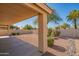 Covered patio and gravel backyard with cacti at 19810 N 90Th Ln, Peoria, AZ 85382