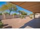 Covered patio area with desert landscaping at 19810 N 90Th Ln, Peoria, AZ 85382