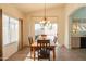 Bright dining room with patio access and wooden table at 19810 N 90Th Ln, Peoria, AZ 85382