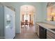 Kitchen features white appliances, ample counter space, and a view of the dining area at 19810 N 90Th Ln, Peoria, AZ 85382