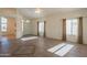 Spacious living room featuring tile floors and access to entryway at 19810 N 90Th Ln, Peoria, AZ 85382