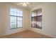 Living room with large windows and tile flooring at 19810 N 90Th Ln, Peoria, AZ 85382