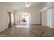Bright living room with tile floors and views to dining area at 19810 N 90Th Ln, Peoria, AZ 85382