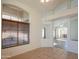 Bright living room featuring large windows and tile floors at 19810 N 90Th Ln, Peoria, AZ 85382