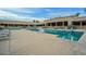 Community pool with lounge chairs and accessibility features at 19810 N 90Th Ln, Peoria, AZ 85382