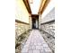 Stone and stucco entryway with a walkway leading to the front door at 2074 N 139 Dr, Goodyear, AZ 85395