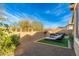 Landscaped backyard featuring a fire pit and seating at 21062 E Via Del Sol --, Queen Creek, AZ 85142
