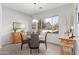 Bright dining room with large window and wood table at 21062 E Via Del Sol --, Queen Creek, AZ 85142