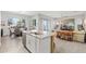 Open concept kitchen and living area with granite island and tile floors at 21062 E Via Del Sol --, Queen Creek, AZ 85142