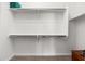 Large walk-in closet with shelving and hanging rods at 21062 E Via Del Sol --, Queen Creek, AZ 85142