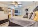 Bright bedroom featuring a king-size bed and ensuite access at 2550 E Corona Ave, Phoenix, AZ 85040