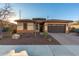 Single-story home with a two-car garage and desert landscaping at 3222 S 186Th Ln, Goodyear, AZ 85338