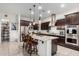 Kitchen with an island, granite countertops, and stainless steel appliances at 3222 S 186Th Ln, Goodyear, AZ 85338
