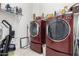 Laundry room with washer and dryer, and storage shelving at 3222 S 186Th Ln, Goodyear, AZ 85338