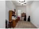 Home office with wood desk, chair, and built-in shelving at 3222 S 186Th Ln, Goodyear, AZ 85338
