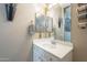 Clean and modern bathroom with white vanity and a large mirror at 32974 N Madison Way Dr, San Tan Valley, AZ 85144