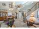 Spacious living room with high ceilings, a chandelier, and hardwood floors at 32974 N Madison Way Dr, San Tan Valley, AZ 85144