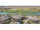 Aerial view of a community with lake, golf course, and residential buildings at 33550 N Dove Lakes Dr # 2023, Cave Creek, AZ 85331