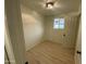 Simple bedroom featuring light walls, wood-look flooring, and a window at 3748 W Mobile Ln, Phoenix, AZ 85041