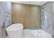 Bathroom with soaking tub and glass shower at 3801 N Goldwater Blvd # 204, Scottsdale, AZ 85251