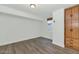 Bright bedroom with wood-look floors and built-in storage at 3801 N Goldwater Blvd # 204, Scottsdale, AZ 85251