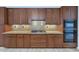 Modern kitchen with ample wood cabinetry and granite counters at 3801 N Goldwater Blvd # 204, Scottsdale, AZ 85251