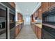 Modern kitchen with wood cabinets and granite countertops at 3801 N Goldwater Blvd # 204, Scottsdale, AZ 85251