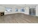 Spacious living area with hardwood floors, fireplace and large windows at 3801 N Goldwater Blvd # 204, Scottsdale, AZ 85251