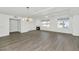Open living room with hardwood floors, fireplace, and access to patio at 3801 N Goldwater Blvd # 204, Scottsdale, AZ 85251