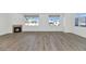Living room with hardwood floors, fireplace and large windows at 3801 N Goldwater Blvd # 204, Scottsdale, AZ 85251
