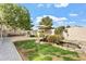 Landscaped backyard with pond, waterfall and grassy areas at 3830 E Carter Dr, Phoenix, AZ 85042