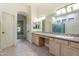 Double vanity bathroom with a large mirror and tile flooring at 3830 E Carter Dr, Phoenix, AZ 85042