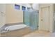 Bathroom with a large soaking tub and a separate shower at 3830 E Carter Dr, Phoenix, AZ 85042