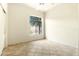 Bright bedroom with tile floors and a large window at 3830 E Carter Dr, Phoenix, AZ 85042