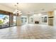 Living room with fireplace, tile floors and access to backyard at 3830 E Carter Dr, Phoenix, AZ 85042