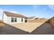Sunny backyard with plenty of space for outdoor activities at 3873 S 233Rd Ln, Buckeye, AZ 85326