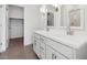 Bright bathroom boasts double sinks, a walk-in shower, and ample storage at 3873 S 233Rd Ln, Buckeye, AZ 85326