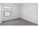 Bright bedroom with carpeted floor and window with blinds at 3873 S 233Rd Ln, Buckeye, AZ 85326