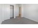 Spacious bedroom with a large closet and carpeted floor at 3873 S 233Rd Ln, Buckeye, AZ 85326