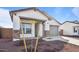 New construction home with a two-car garage and desert landscaping at 3873 S 233Rd Ln, Buckeye, AZ 85326