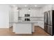 Modern kitchen with stainless steel appliances and an island at 3873 S 233Rd Ln, Buckeye, AZ 85326