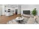 Open concept living room and kitchen with modern decor at 3873 S 233Rd Ln, Buckeye, AZ 85326