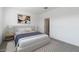 Main bedroom with a bed and nightstands at 3873 S 233Rd Ln, Buckeye, AZ 85326
