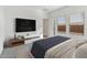 Main bedroom with TV and a comfortable bed at 3873 S 233Rd Ln, Buckeye, AZ 85326