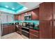Updated kitchen with teal cabinets and black countertops at 4135 N 17Th St # 8, Phoenix, AZ 85016