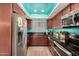 Modern kitchen with teal accents and stainless steel appliances at 4135 N 17Th St # 8, Phoenix, AZ 85016