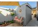 Charming backyard patio with seating area, shade structure, and storage shed at 4135 N 17Th St # 8, Phoenix, AZ 85016